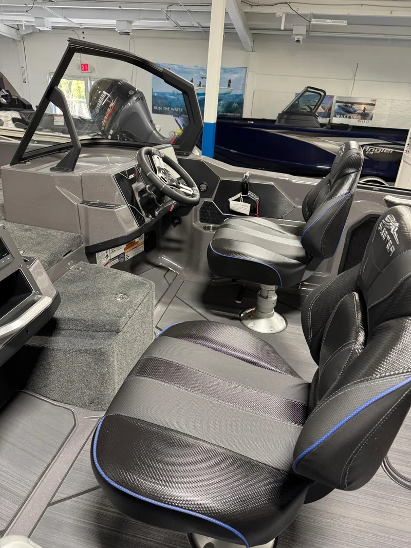 Slide: The Image of 2025 Skeeter WXR 2260 F boat interior with modern seating and steering console. - 10