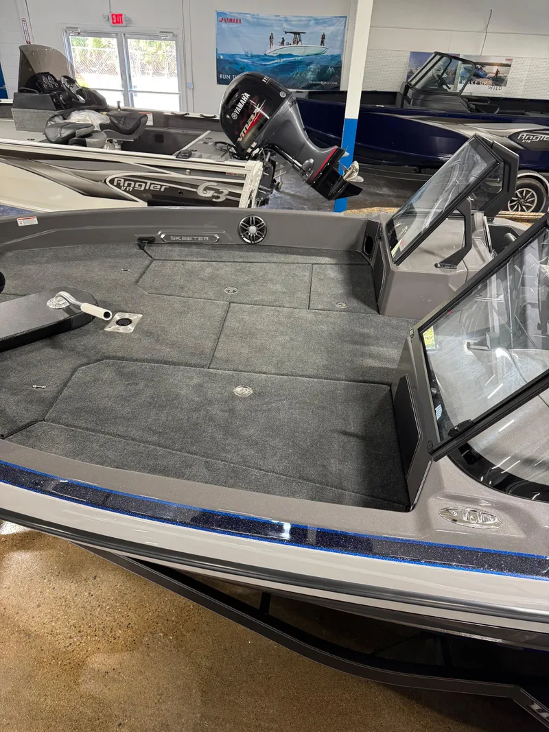 Slide: The Image of 2025 Skeeter WXR 2260 F fishing boat with spacious deck and modern design. - 11