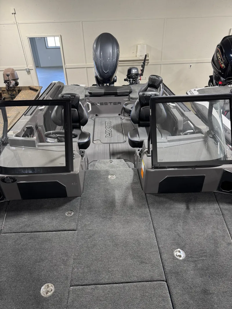 Slide: The Image of 2025 Skeeter WXR 2260 F boat interior with open windshield and seating. - 14