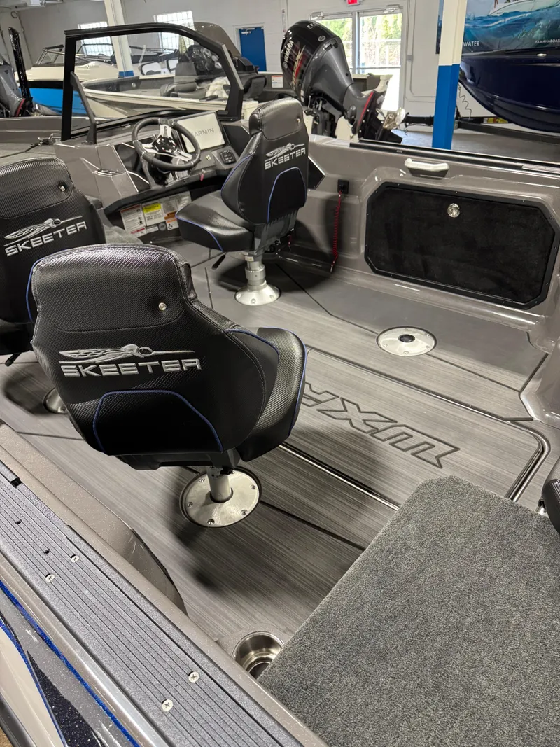 Slide: The Image of 2025 Skeeter WXR 2260 F boat interior with sleek seating and modern dashboard. - 7