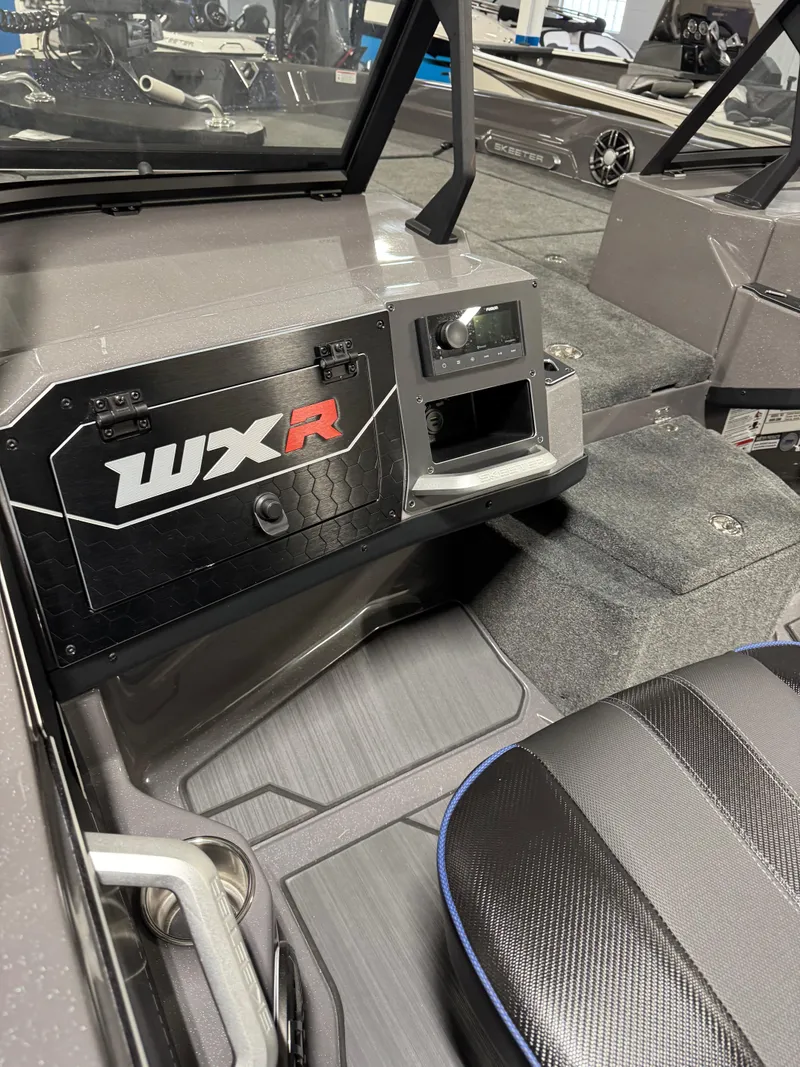 Slide: The Image of 2025 Skeeter WXR 2260 F boat interior with sleek dashboard and seating. - 9