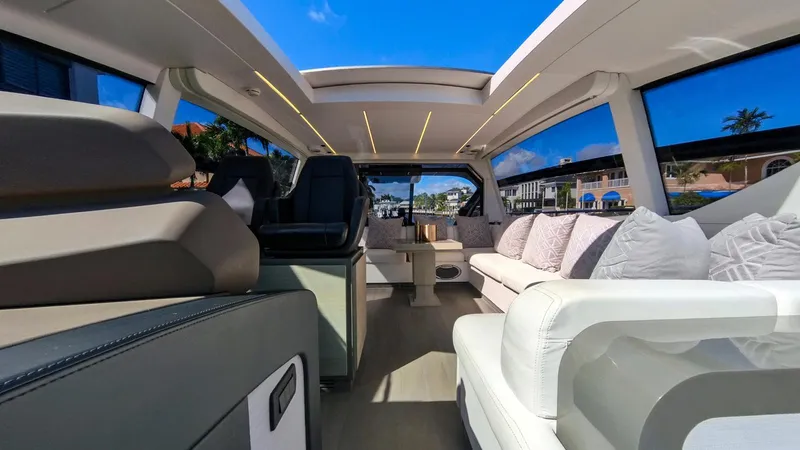 Slide: The Image of Luxurious interior of a 2014 Pershing 62 yacht with modern seating and panoramic windows. - 3