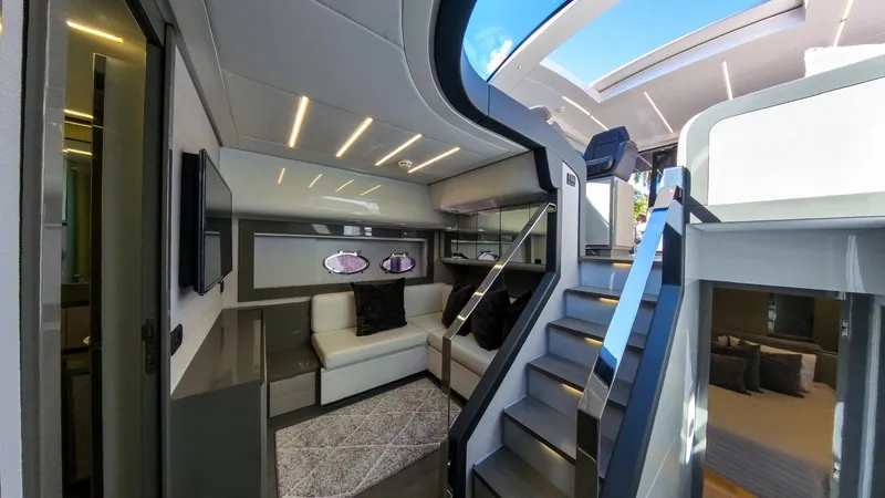 Slide: The Image of Luxurious interior of a 2014 Pershing 62 yacht with modern design and elegant furnishings. - 4