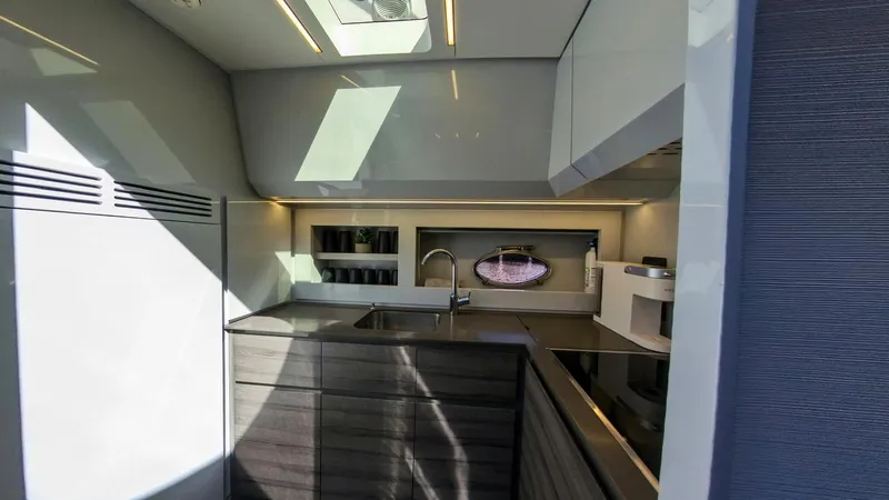 Slide: The Image of Modern kitchen interior of 2014 Pershing 62 yacht with sleek design and ample lighting. - 6