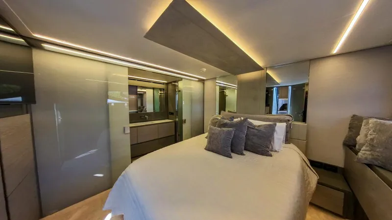 Slide: The Image of Luxurious bedroom interior of 2014 Pershing 62 yacht with modern design and ambient lighting. - 7