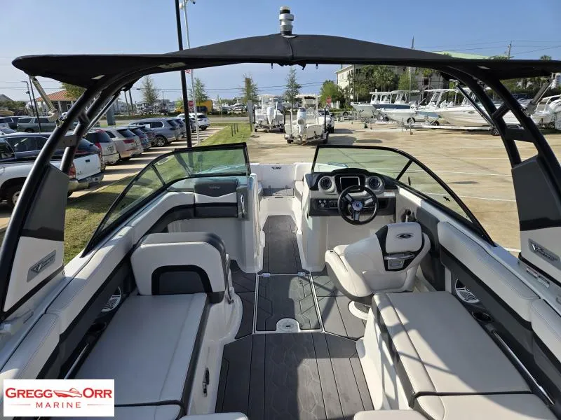 Slide: The Image of 2018 Chaparral 223VRX boat interior with seating and dashboard, displayed at Gregg Orr Marine. - 13