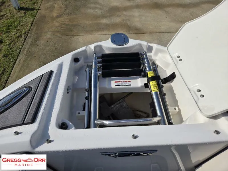 Slide: The Image of 2018 Chaparral 223VRX boat ladder and storage compartment, displayed by Gregg Orr Marine. - 16