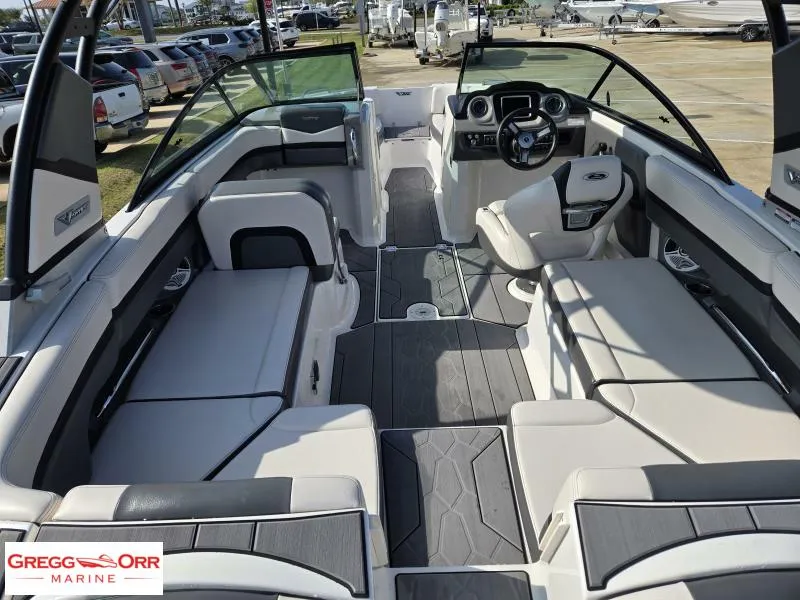 Slide: The Image of 2018 Chaparral 223VRX boat interior with modern seating and dashboard. - 5