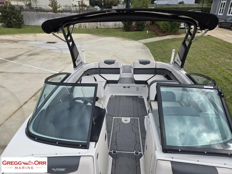 Slide: The Image of 2018 Chaparral 223VRX boat interior with open seating and sleek design. - 6