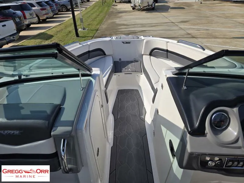 Slide: The Image of 2018 Chaparral 223VRX boat interior with sleek seating and modern dashboard. - 9