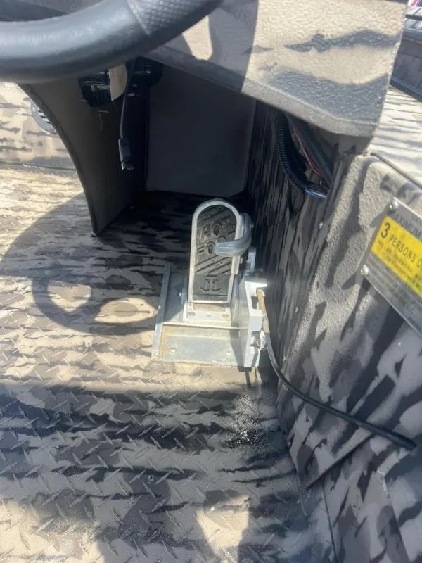Slide: The Image of 2020 Havoc Boats 1753 RR interior with steering wheel and pedal, camo design. - 11