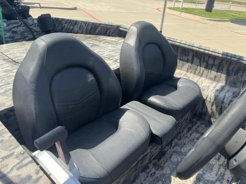 Slide: The Image of 2020 Havoc Boats 1753 RR interior with dual black seats and camouflage design. - 12