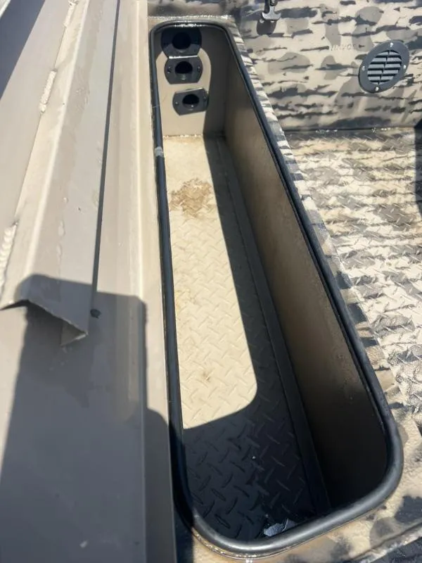 Slide: The Image of 2020 Havoc Boats 1753 RR interior storage compartment with diamond plate flooring. - 18