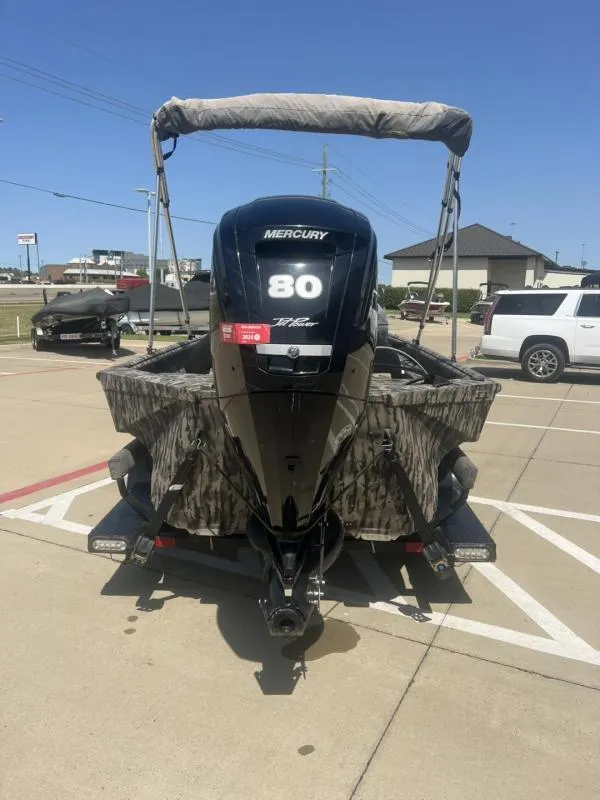 Slide: The Image of 2020 Havoc Boats 1753 RR with Mercury 80 engine, parked in a lot. - 4