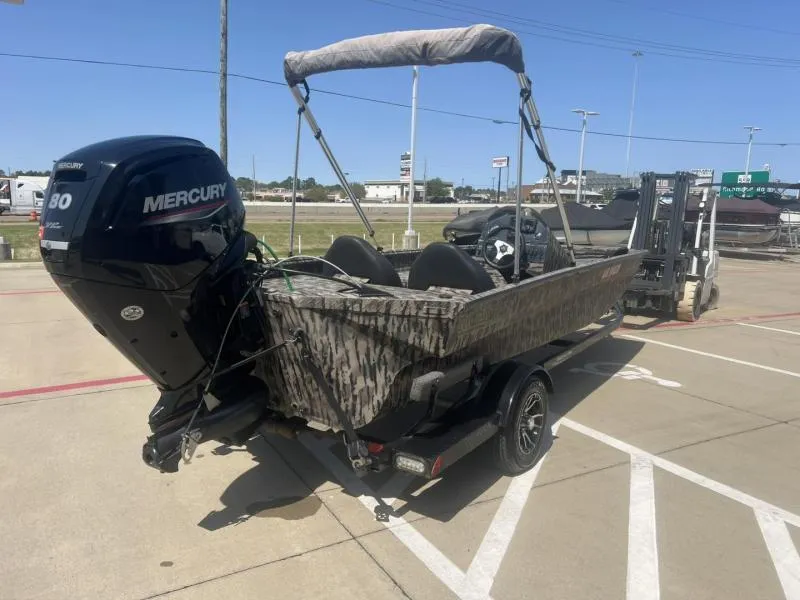 Slide: The Image of 2020 Havoc Boats 1753 RR with Mercury engine on trailer in parking lot. - 5