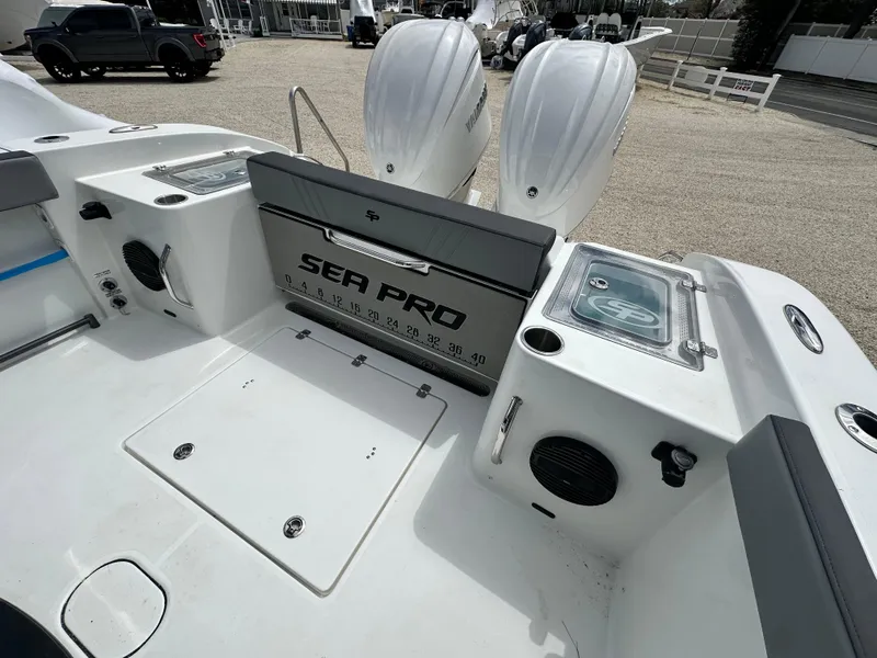 Slide: The Image of 2025 Sea Pro 292 Offshore boat interior with dual engines and storage compartments. - 15