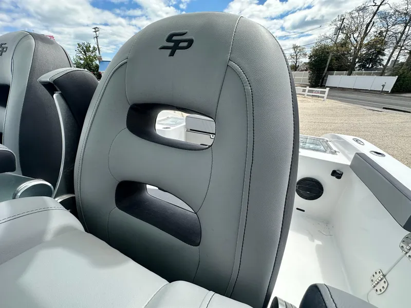 Slide: The Image of 2025 Sea Pro 292 Offshore boat seat with logo, featuring sleek gray upholstery. - 20