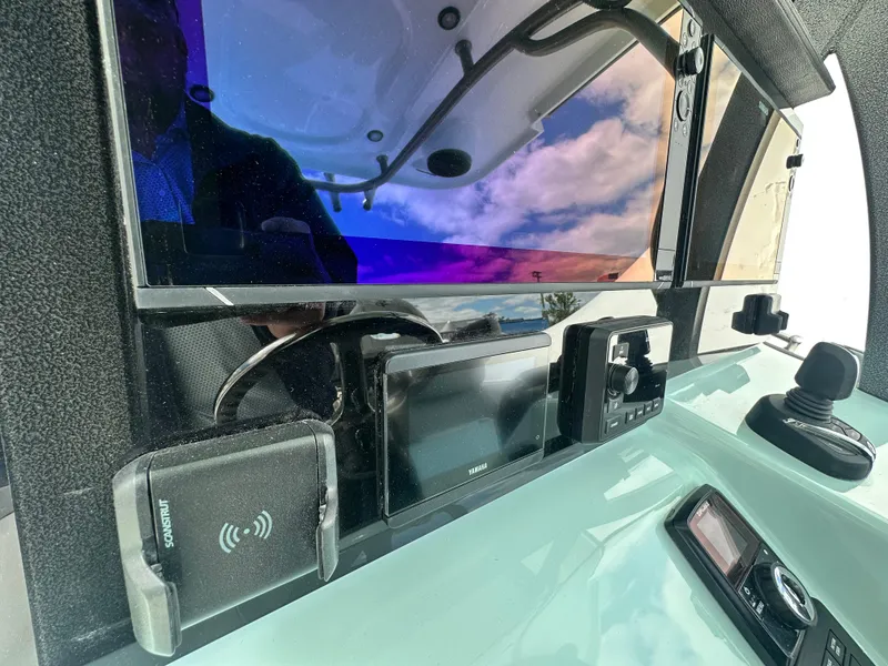 Slide: The Image of Dashboard of 2025 Sea Pro 292 Offshore boat with advanced navigation technology. - 27