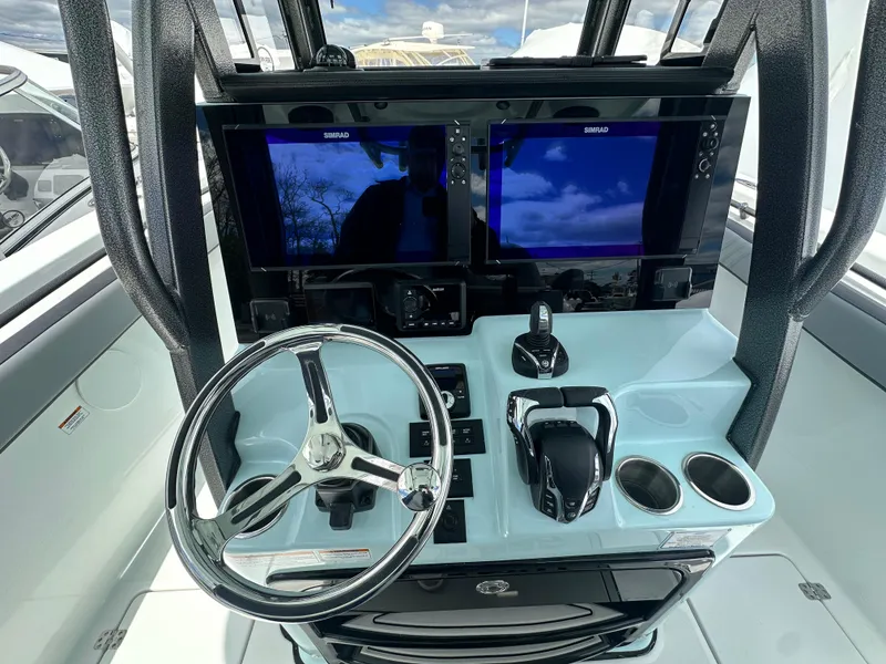 Slide: The Image of 2025 Sea Pro 292 Offshore helm with dual displays and modern controls. - 28