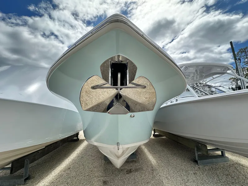 Slide: The Image of 2025 Sea Pro 292 Offshore boat, front view, with cloudy sky background. - 3