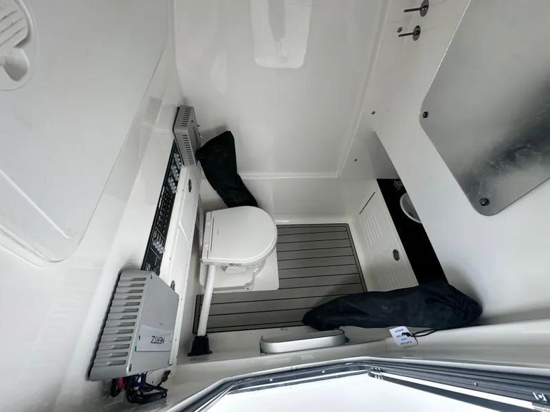 Slide: The Image of 2025 Sea Pro 292 Offshore boat interior with toilet and modern amenities. - 32