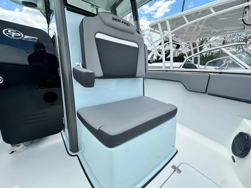 Slide: The Image of 2025 Sea Pro 292 Offshore boat interior with cushioned seating and modern design. - 36