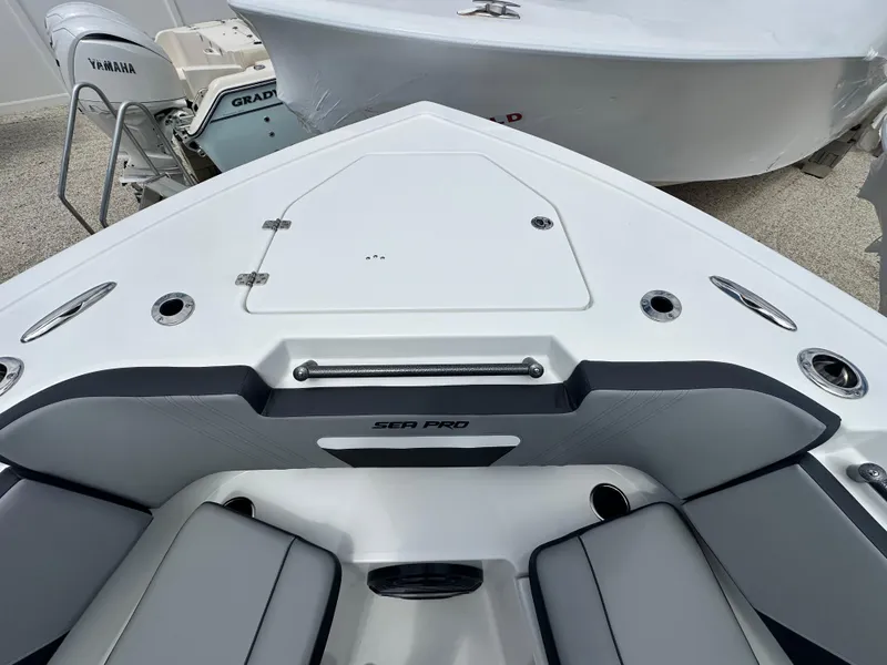 Slide: The Image of 2025 Sea Pro 292 Offshore boat interior with seating and storage compartments. - 39