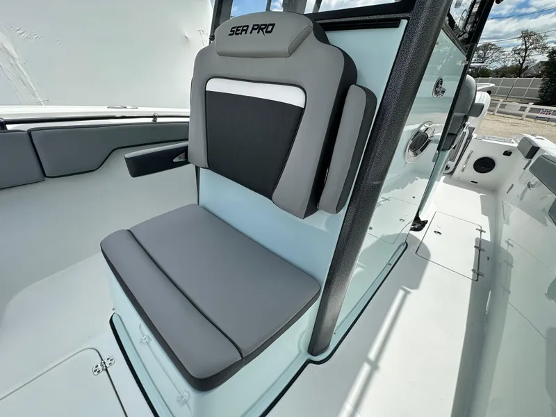 Slide: The Image of 2025 Sea Pro 292 Offshore boat seat, featuring modern design and comfortable gray upholstery. - 43