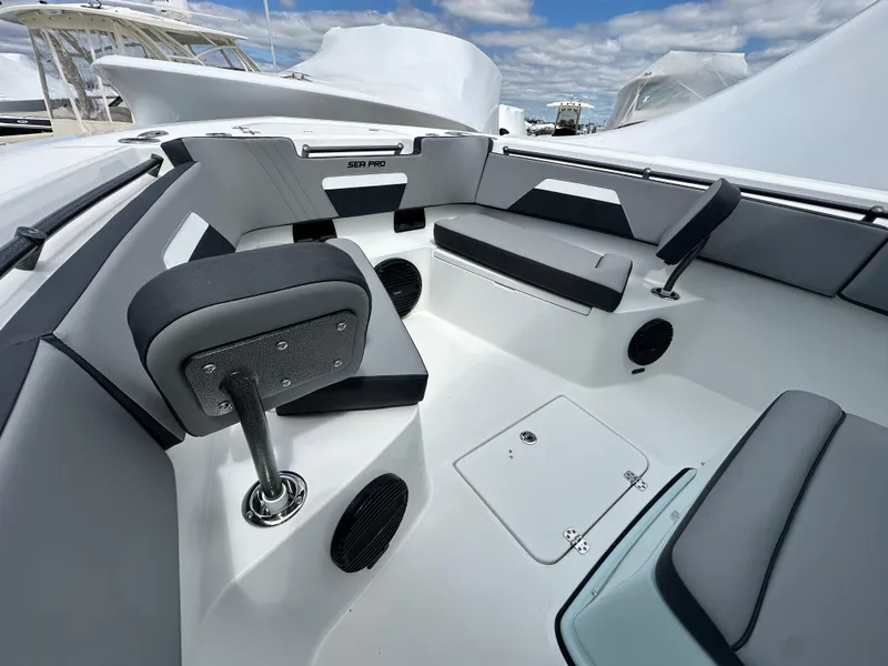 Slide: The Image of 2025 Sea Pro 292 Offshore boat interior with seating and storage compartments. - 44
