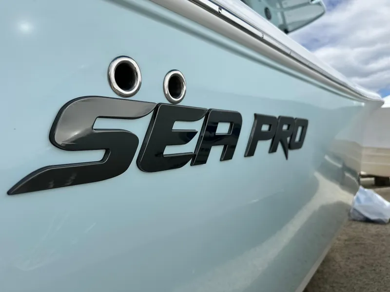 Slide: The Image of 2025 Sea Pro 292 Offshore boat logo on sleek hull. - 5