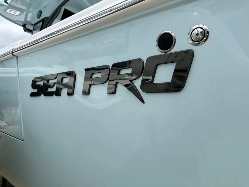 Slide: The Image of 2025 Sea Pro 292 Offshore boat logo on sleek exterior. - 6
