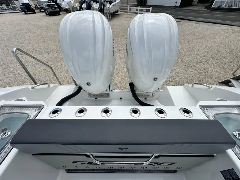 Slide: The Image of 2025 Sea Pro 292 Offshore boat with dual outboard engines, rear view. - 9