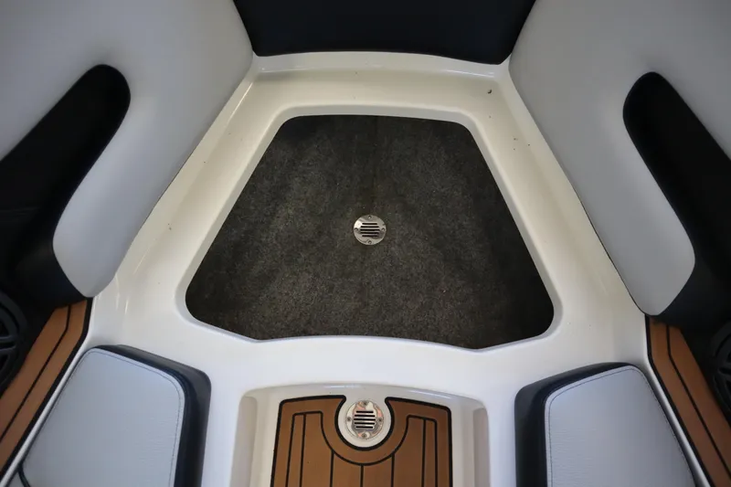 Slide: The Image of Interior of 2020 Nautique Super Air Nautique 230 boat, featuring seating and flooring. - 10