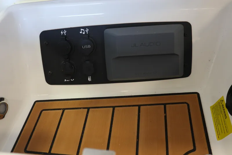 Slide: The Image of Control panel of 2020 Nautique Super Air Nautique 230 with USB and JL Audio system. - 15