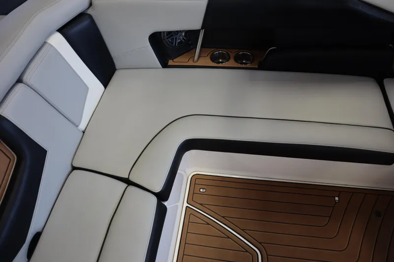Slide: The Image of 2020 Nautique Super Air Nautique 230 interior with sleek seating and stylish flooring. - 20