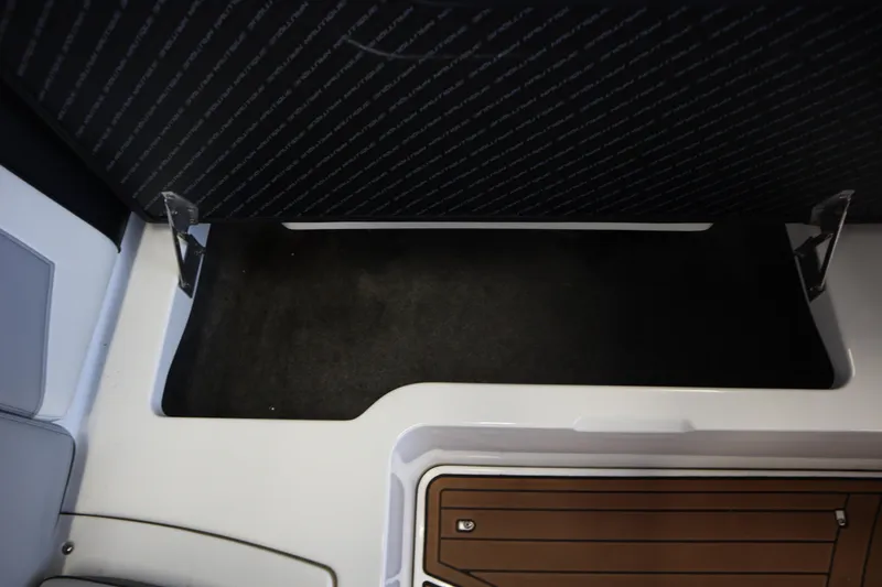Slide: The Image of 2020 Nautique Super Air Nautique 230 interior storage compartment detail. - 21