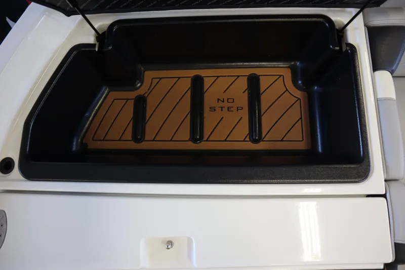 Slide: The Image of 2020 Nautique Super Air Nautique 230 storage compartment with "No Step" warning. - 30