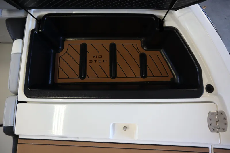 Slide: The Image of 2020 Nautique Super Air Nautique 230 storage compartment with "No Step" warning. - 33