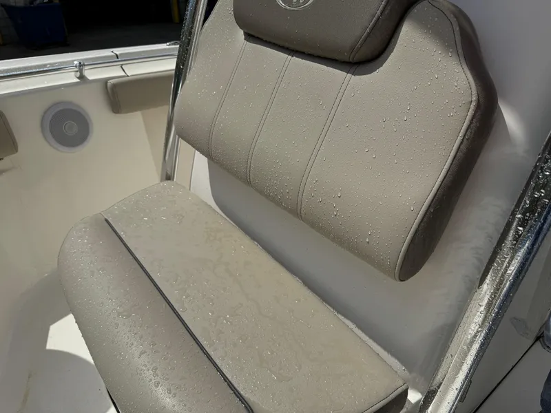 Slide: The Image of 2022 Key West 219 FS boat seat with water droplets, showcasing comfort and durability. - 11