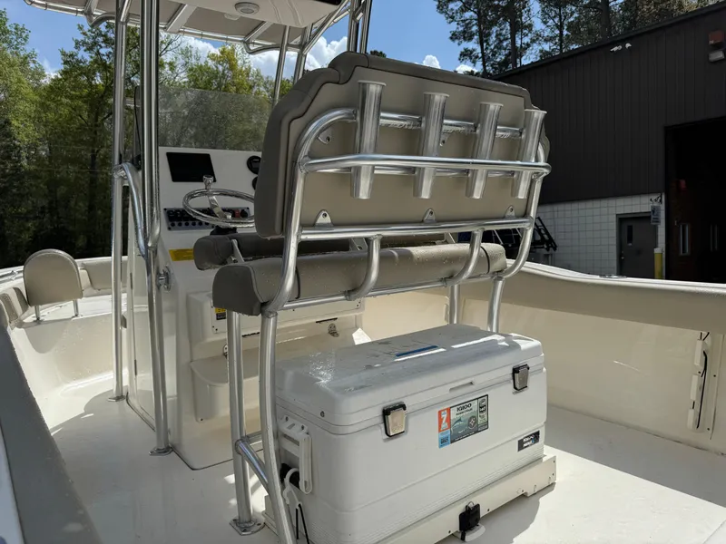 Slide: The Image of 2022 Key West 219 FS boat interior with seating and cooler, outdoor setting. - 12
