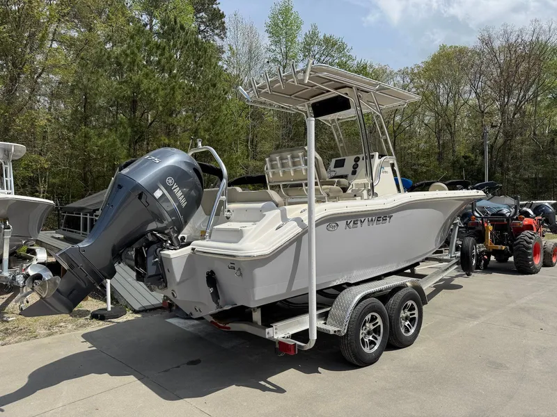 Slide: The Image of 2022 Key West 219 FS boat on trailer with Yamaha outboard motor. - 2