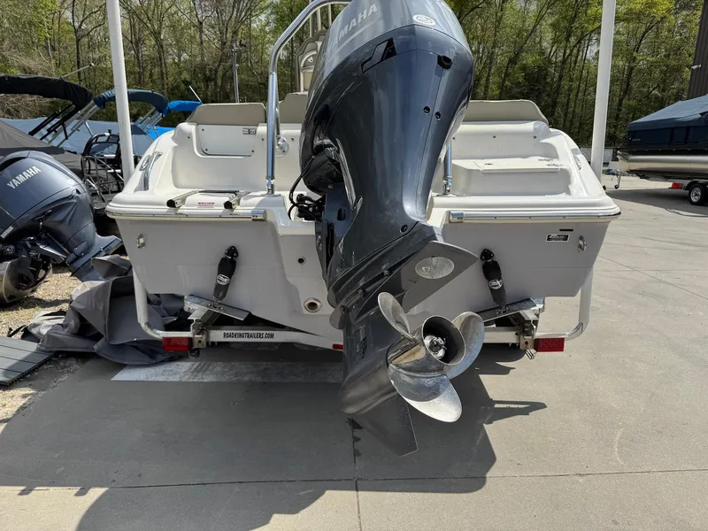Slide: The Image of 2022 Key West 219 FS boat with Yamaha outboard motor, parked on a trailer. - 3