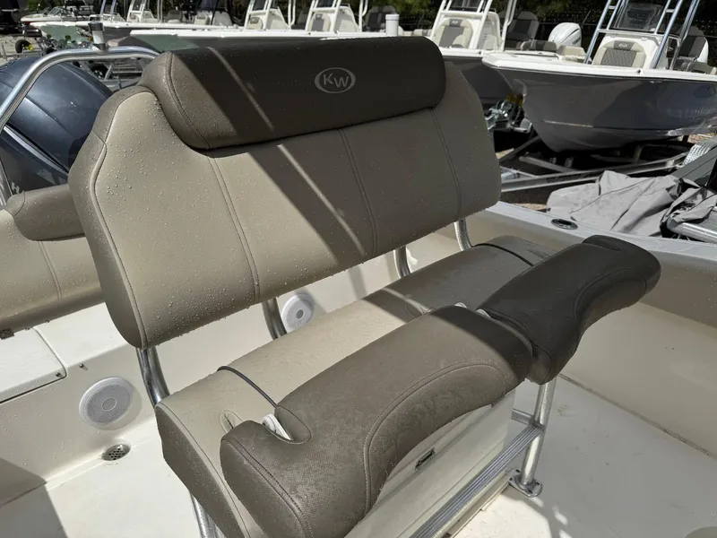 Slide: The Image of 2022 Key West 219 FS boat seat with gray upholstery and KW logo. - 8