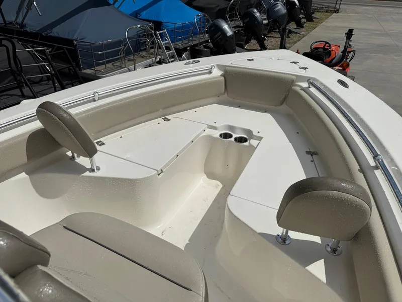 Slide: The Image of 2022 Key West 219 FS boat interior with seating and cup holders. - 9
