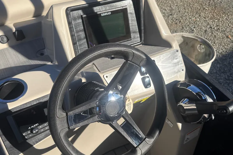 Slide: The Image of Steering console of 2023 Harris HCX230 SL boat with Simrad display. - 19