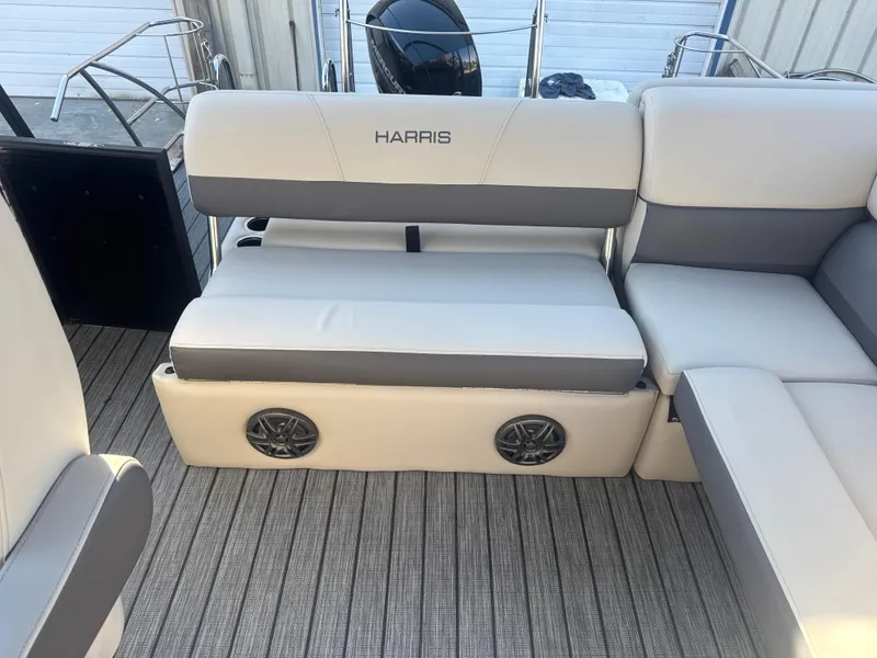 Slide: The Image of Luxurious seating on 2023 Harris HCX230 SL boat with integrated speakers and modern design. - 22