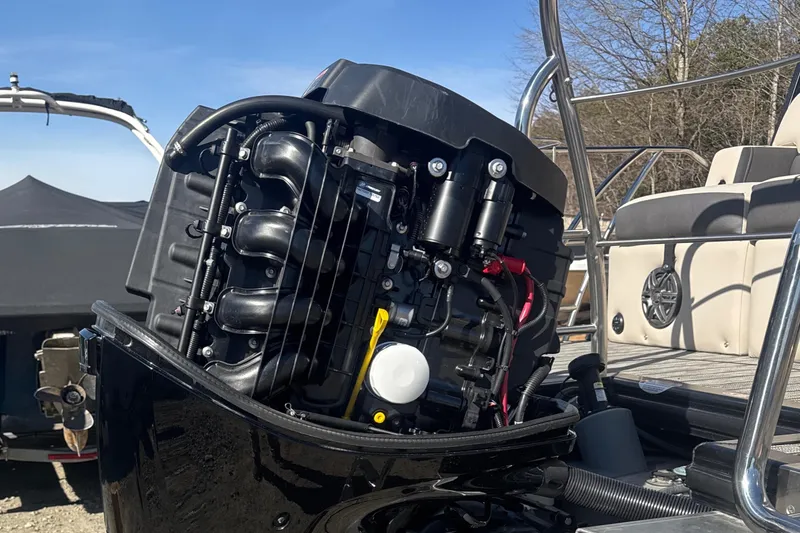 Slide: The Image of 2023 Harris HCX230 SL boat engine, detailed view, outdoors, sunny day. - 27