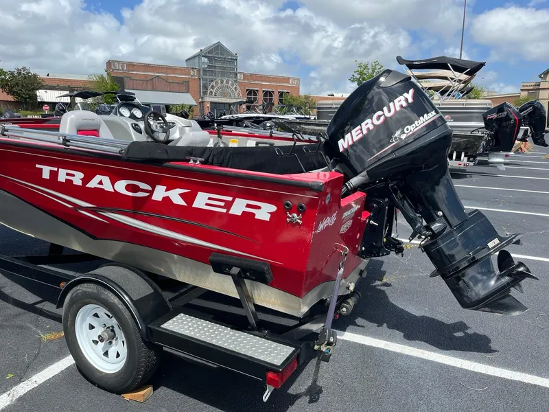 Slide: The Image of 2012 Tracker Pro Guide V-175 SC boat with Mercury outboard motor in parking lot. - 6