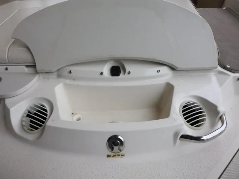 Slide: The Image of 2015 Stingray 198LX boat rear view with storage compartment and ventilation grilles. - 10