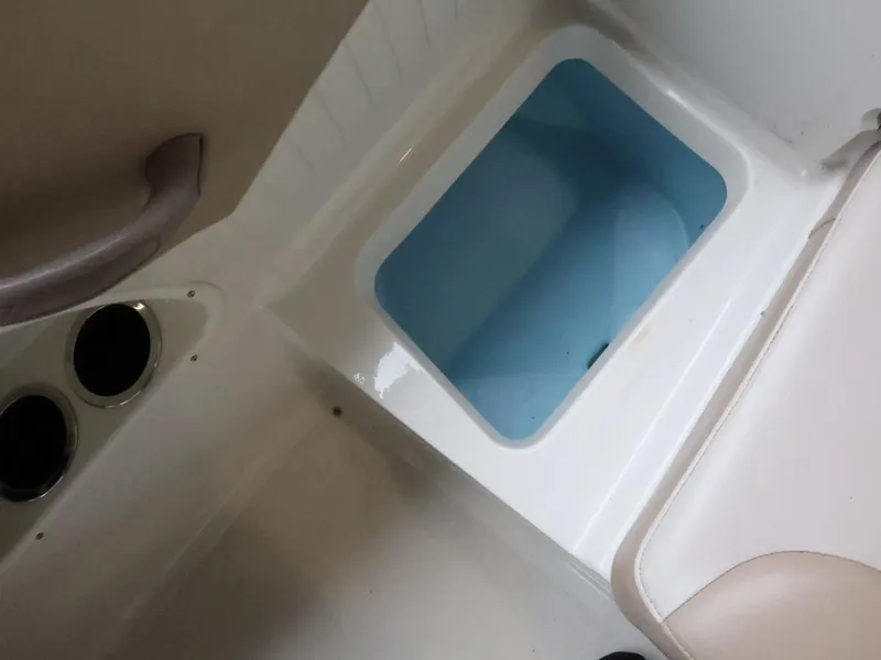 Slide: The Image of 2015 Stingray 198LX boat interior with livewell and seating area. - 16